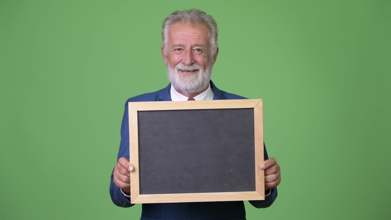 초록색 배경 에 있는 잘생긴 수염 이 있는 상인