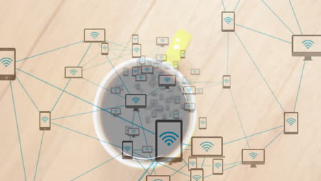 coffee cup sitting on wooden desk while teal network icons connecting smartphones tablets laptops