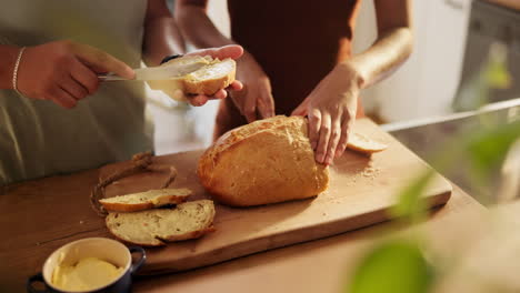 friends preparing bread with butter