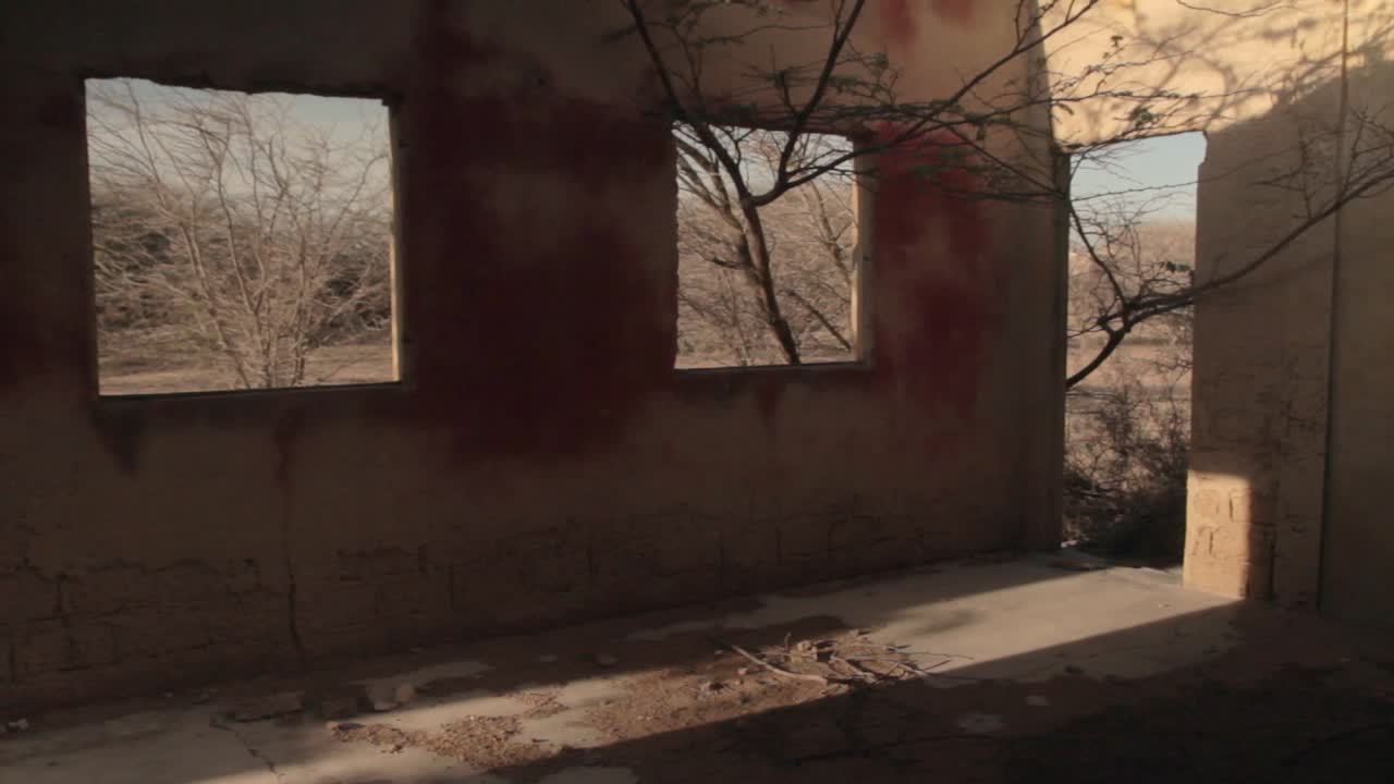 Mid shot from the interior of a house in the ghost town of Puerto , in northern Guajira, Colombia