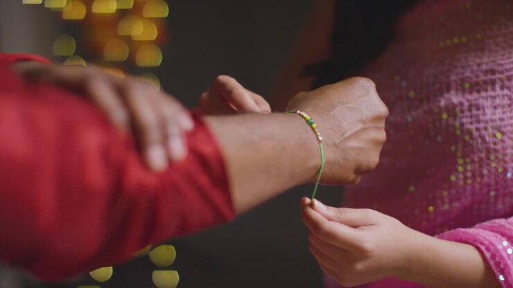Sister Ties Rakhi and Brother Gifts Money for Raksha Bandhan