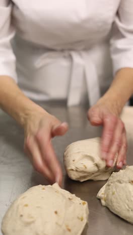 chef kneading dough