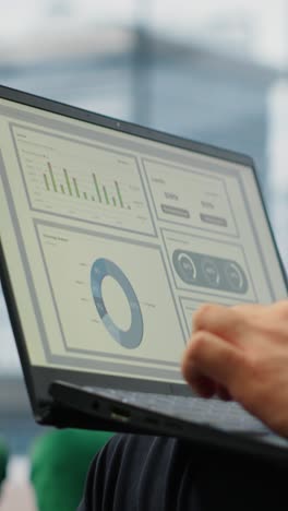 vertical video general director reviewing infographics and monthly reports