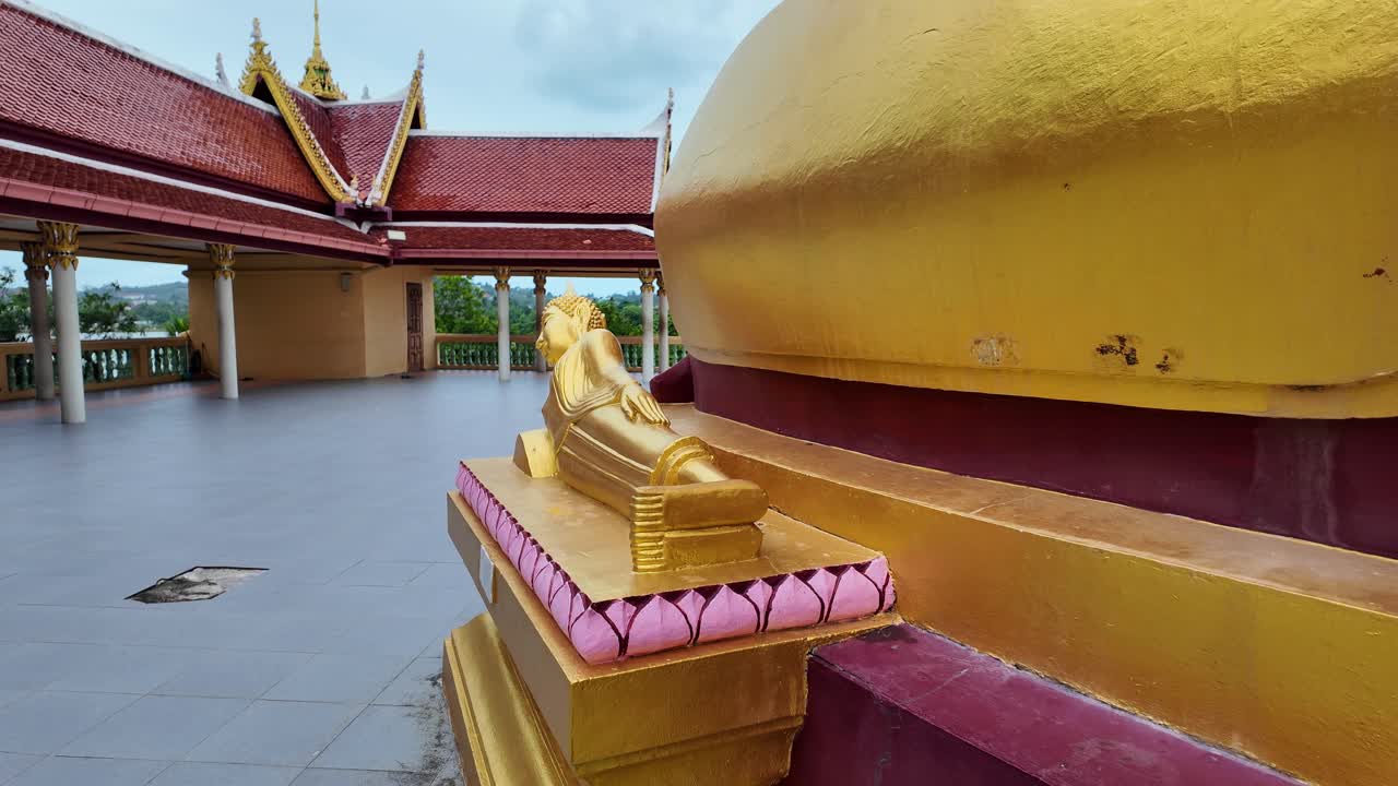 Small reclining buddha statue at Big Buddha Temple Wat Phra Yai Thailand Koh Samui