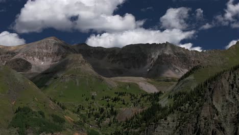 telluride yankee boy basin colorado black bear pass road dirt road 4wd hiking blue sky cliffside valley aerial drone ouray ridgway summer box canyon bridal veil falls aspen forest left motion