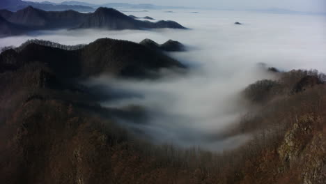 mountains and valleys covered in fog