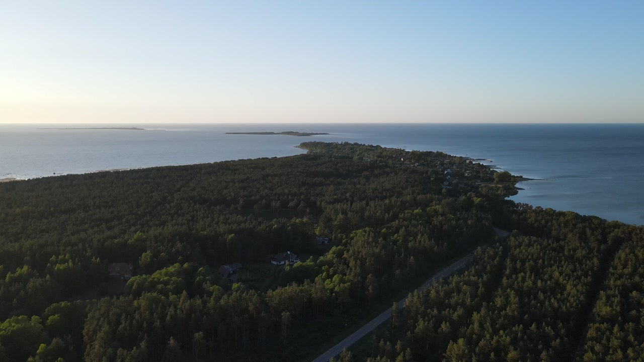 Drone Video of Peninsula with Forest and Road on Sea Coast