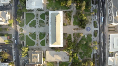 aerial top-down view of a city block or campus with buildings, parks, and roads
