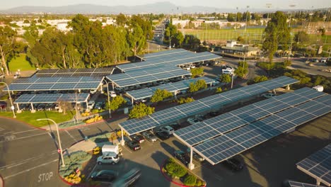 explore the innovative green energy solution at this parking lot with its rooftop solar panels and lush green trees in this stunning drone time-lapse, showcasing clean energy