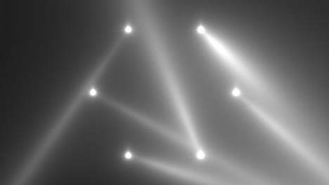 animation motion white glowing spotlight beams on dark background in stage