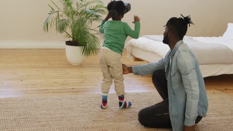 Father-and-son-at-home-using-VR