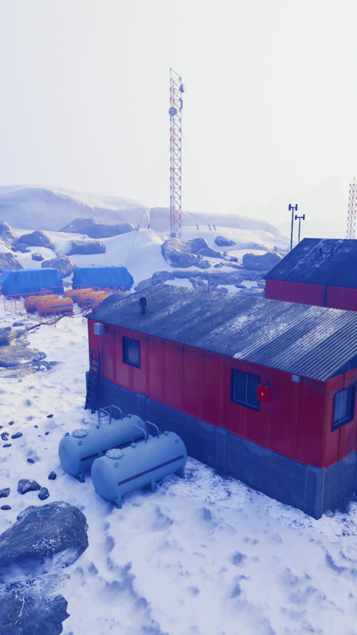 Research station in snowy landscape with communication towers in winter
