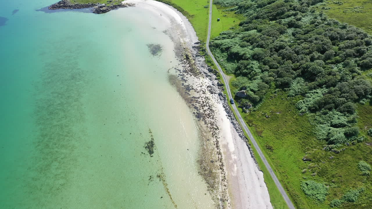 Aerial view showing the beautiful coastal beaches on the Island of Islay Scotland, showing blue sea and sunny daylight