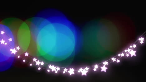 animation of light spots and stars on black background