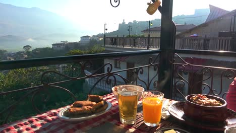 Rich-Albanian-breakfast-with-a-view-of-the-valley-and-towards-the-fortress-with-tower