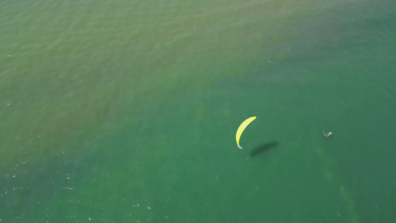 Drone Aerial of Kiteboarder Skimming the Ocean