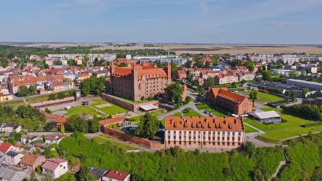 aerial wide view of gniew castle poland, historic fortress and town surroundings