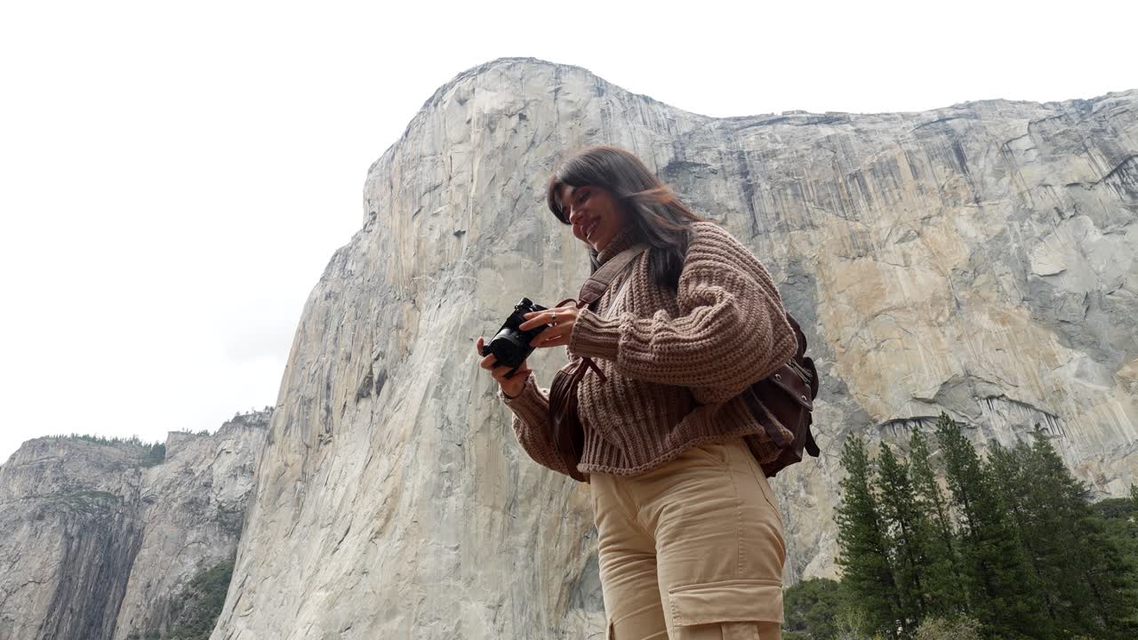Woman Photographer Takes Picture of El Capitan in Yosemite National Park