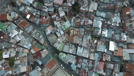 drone aerial of medellin slums, comuna 13 from above, colombia city ghetto area, south america