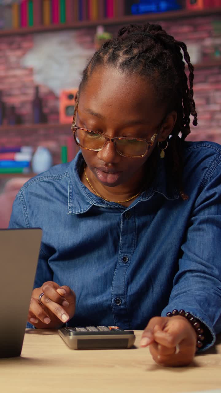 Stressed African American Woman Calculating Finances at Home Office