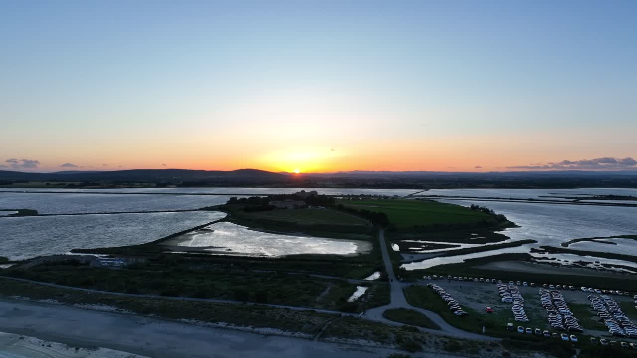 Aerial Sunset View of Coastal Landscape and Salt Flats