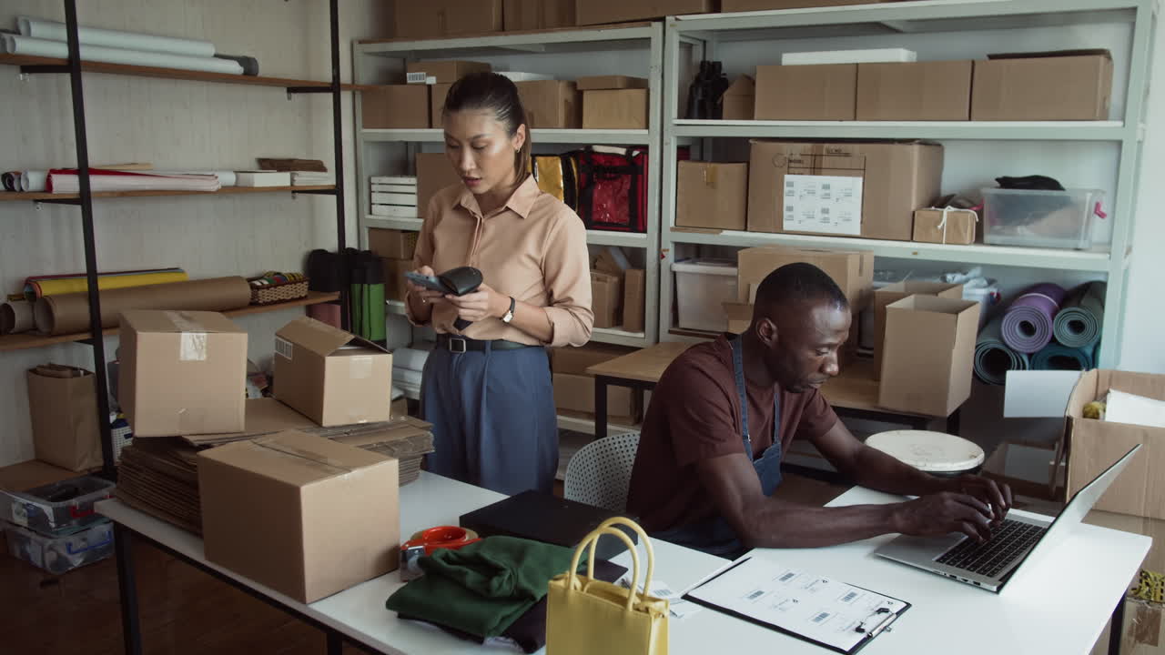 Couple of Delivery Service Specialists Working Together at Warehouse