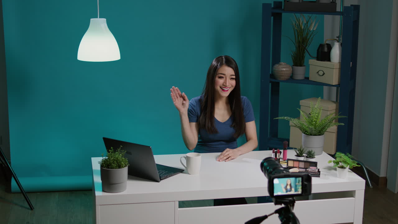 Asian vlogger filming beauty tutorial with smartphone camera