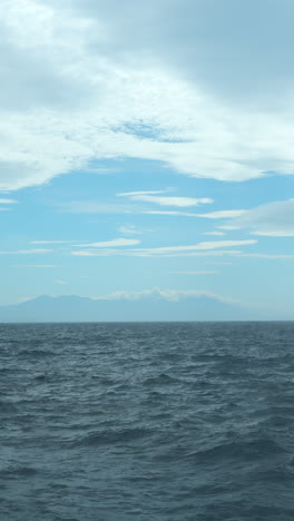 ocean view with mountains and clouds