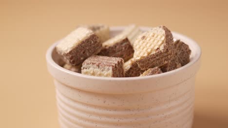 close up of chocolate wafers in a bowl