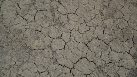 dried lifeless parched barren clay ground, high angle pov