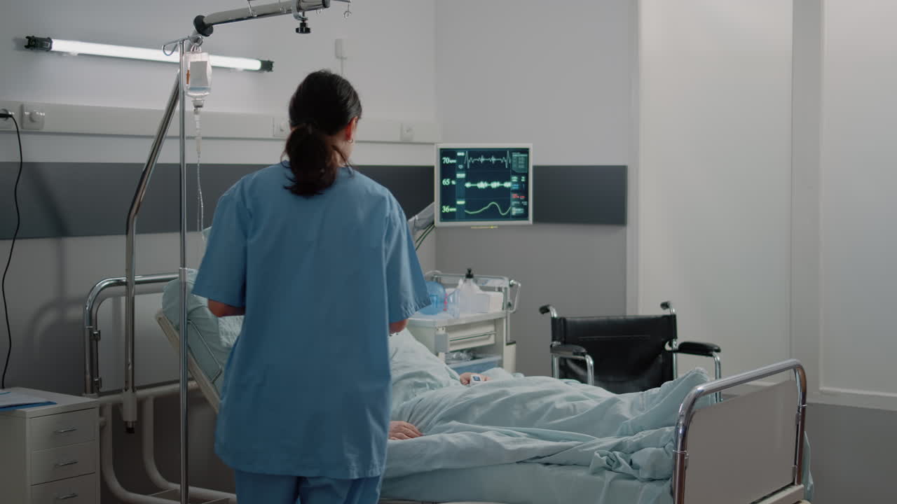 Doctor and nurse with tablet talking about treatment for patient