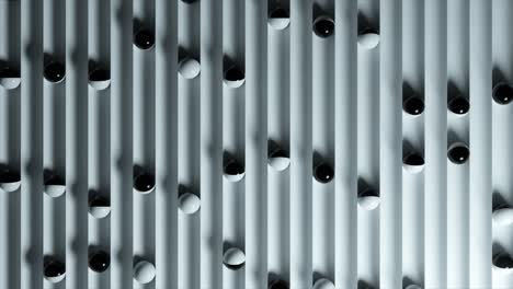 abstract pattern of black and white spheres on vertical stripes