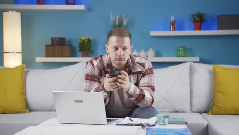 home office worker man getting bad news on the phone.