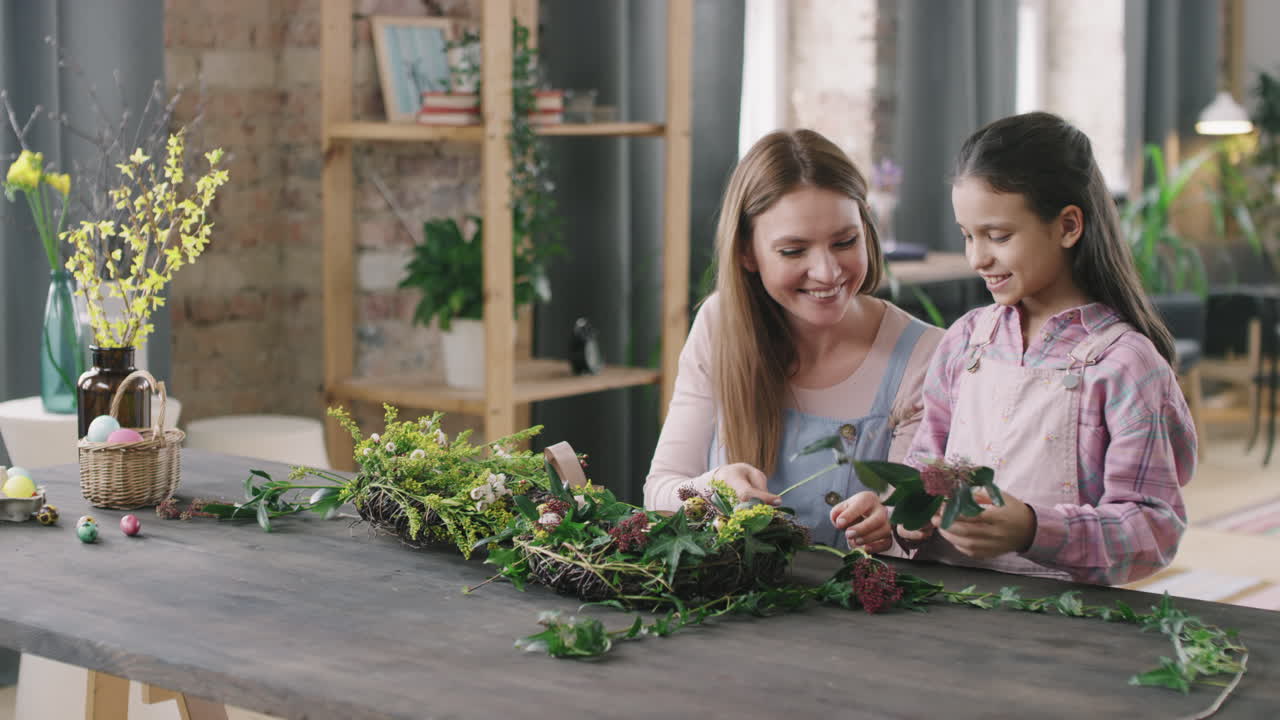 Happy Woman and Girl Making Flower Arrangement