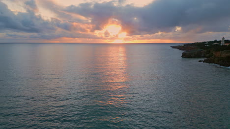 dramatic cloudy marine panorama drone view. sunlight breaking thunder clouds