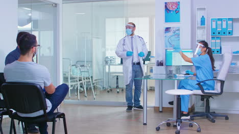 nurse measuring temperature in private hospital