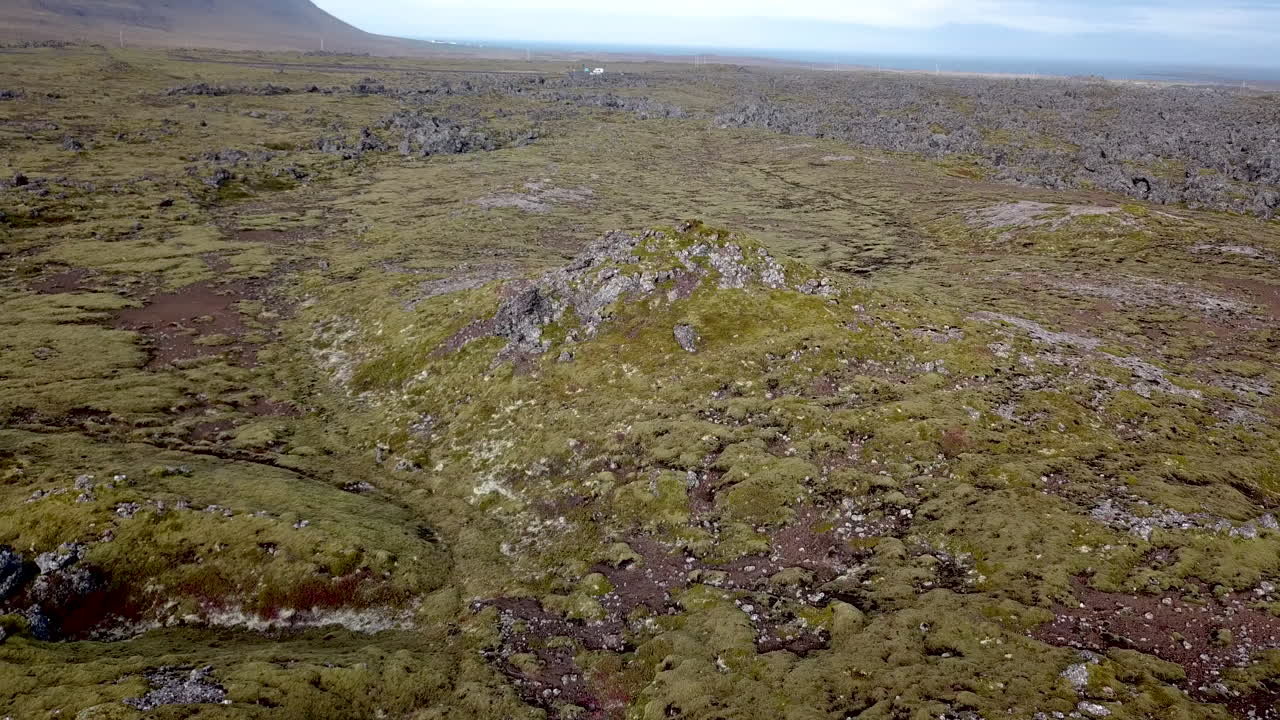 Aerial flight around a massive lava field in Iceland