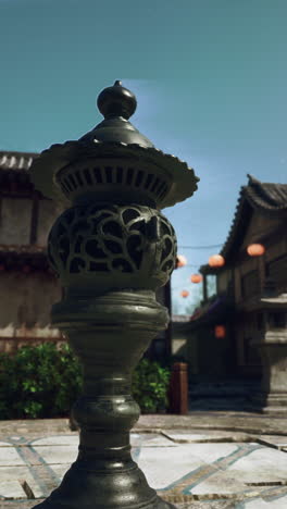 ancient incense burner in a tranquil asian garden