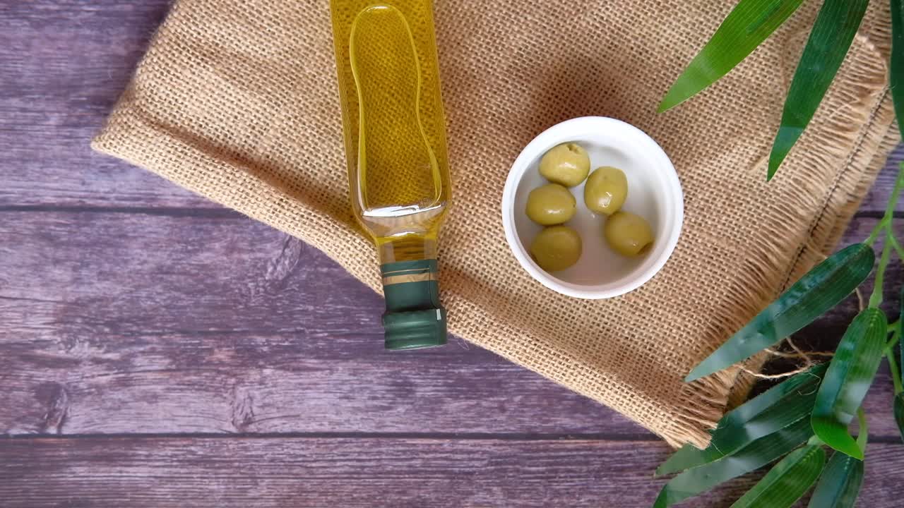 Olives and Olive Oil on Burlap