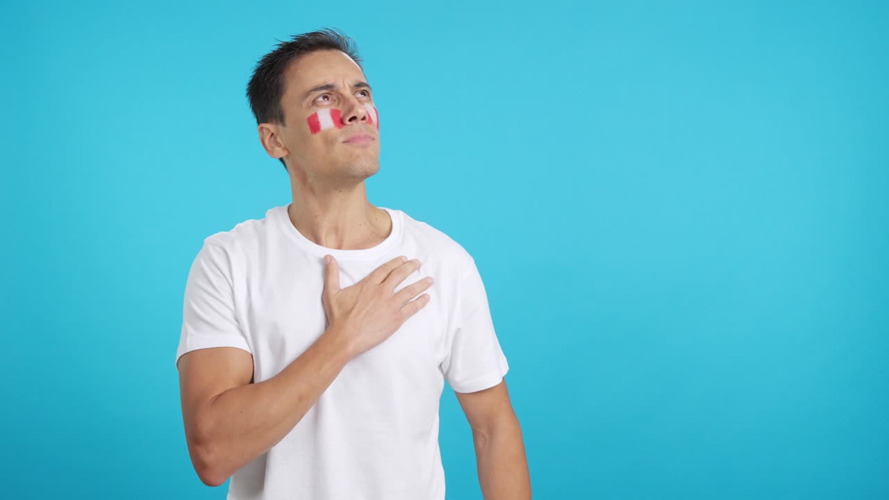 Man listening to the Peru national anthem with solemnity