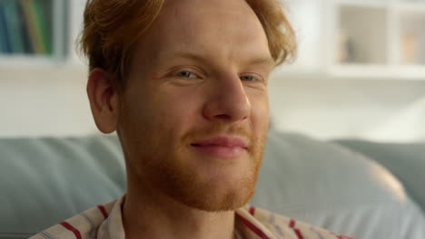 happy businessman enjoy weekend at home closeup. smiling ginger guy relaxing