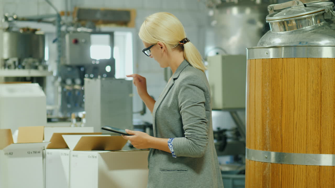 Woman Checks Inventory With Tablet