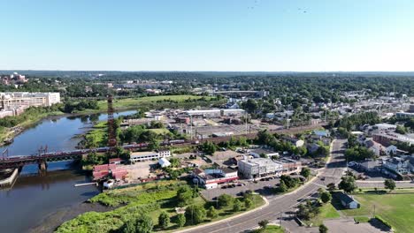 an aerial view by the norwalk river railroad bridge on a sunny morning