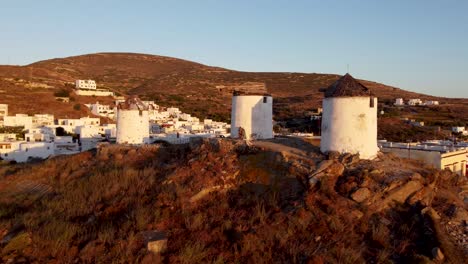 aerial orbit over windmills in vivlos village, naxos, greece