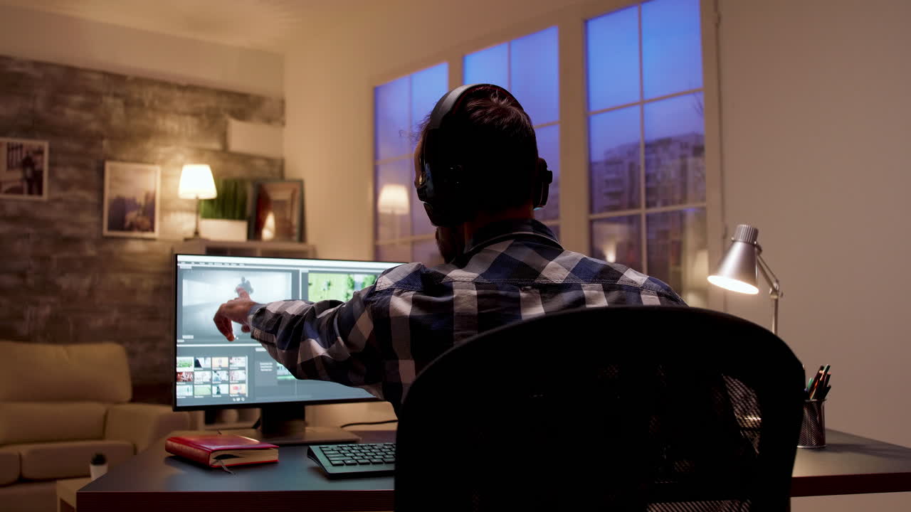 Man working on video editing at night