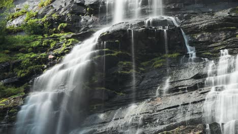 falling water cascades over the dark rocks