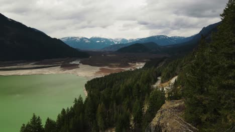 Aerial-drone-shot-of-frozen-Lillooet-Lake-in-British-Columbia,-Canada