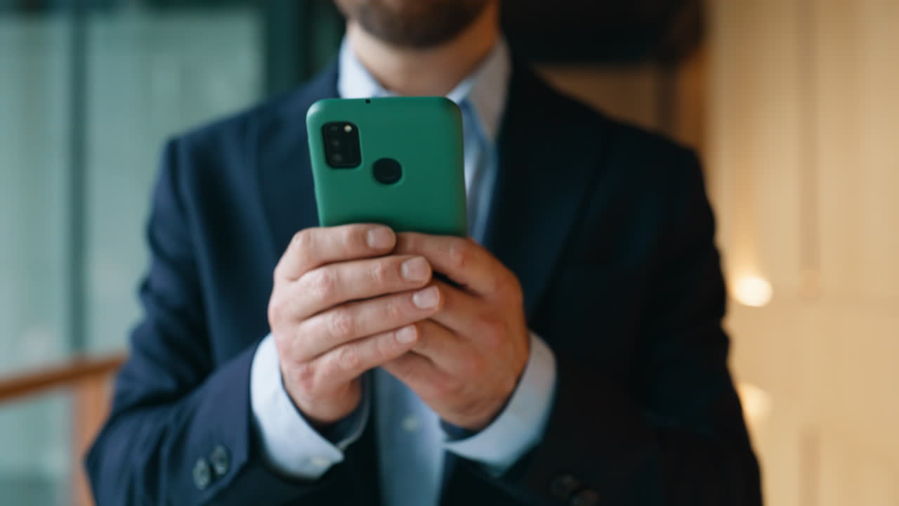 Ceo hands browsing smartphone walking office hall closeup. Elegant businessman