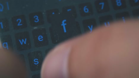 person texts message on phone keyboard extreme close view