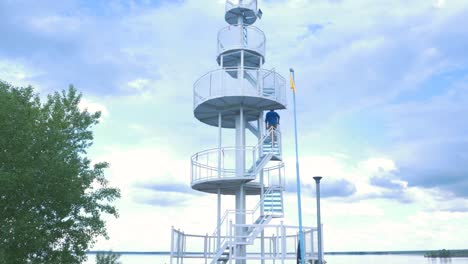 observation tower by the lake on a cloudy day